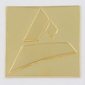 Casted sample of the Castimize logo in 18K gold plated brass