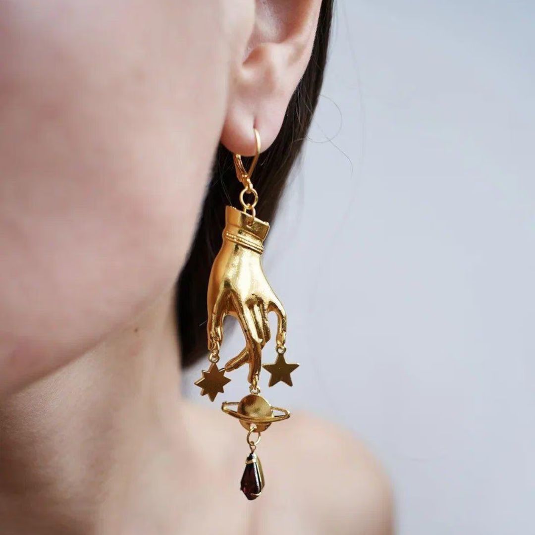 Gold hand and star drop earrings with crystal detail by amzeena