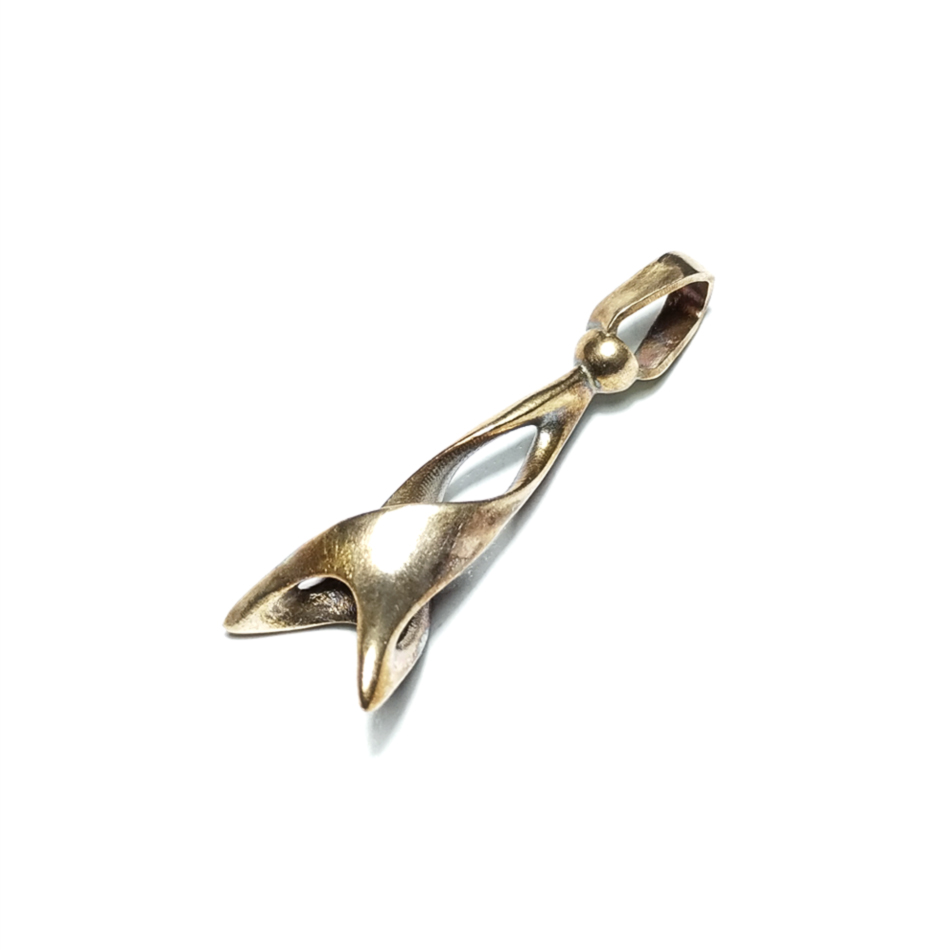 Natural bronze pendant with flowing organic shape created using lost wax casting by designer Quim Nea from Proyecto Medievo