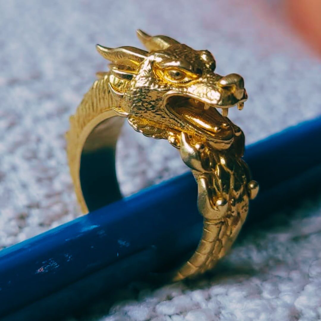 Side view of final casted Tripo AI dragon ring in brass.